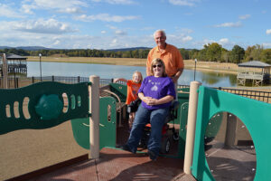 GMC Project Architect Mike Hamrick with Michele Miller, Ms. Wheelchair Alabama 2012, on the boundless playground.