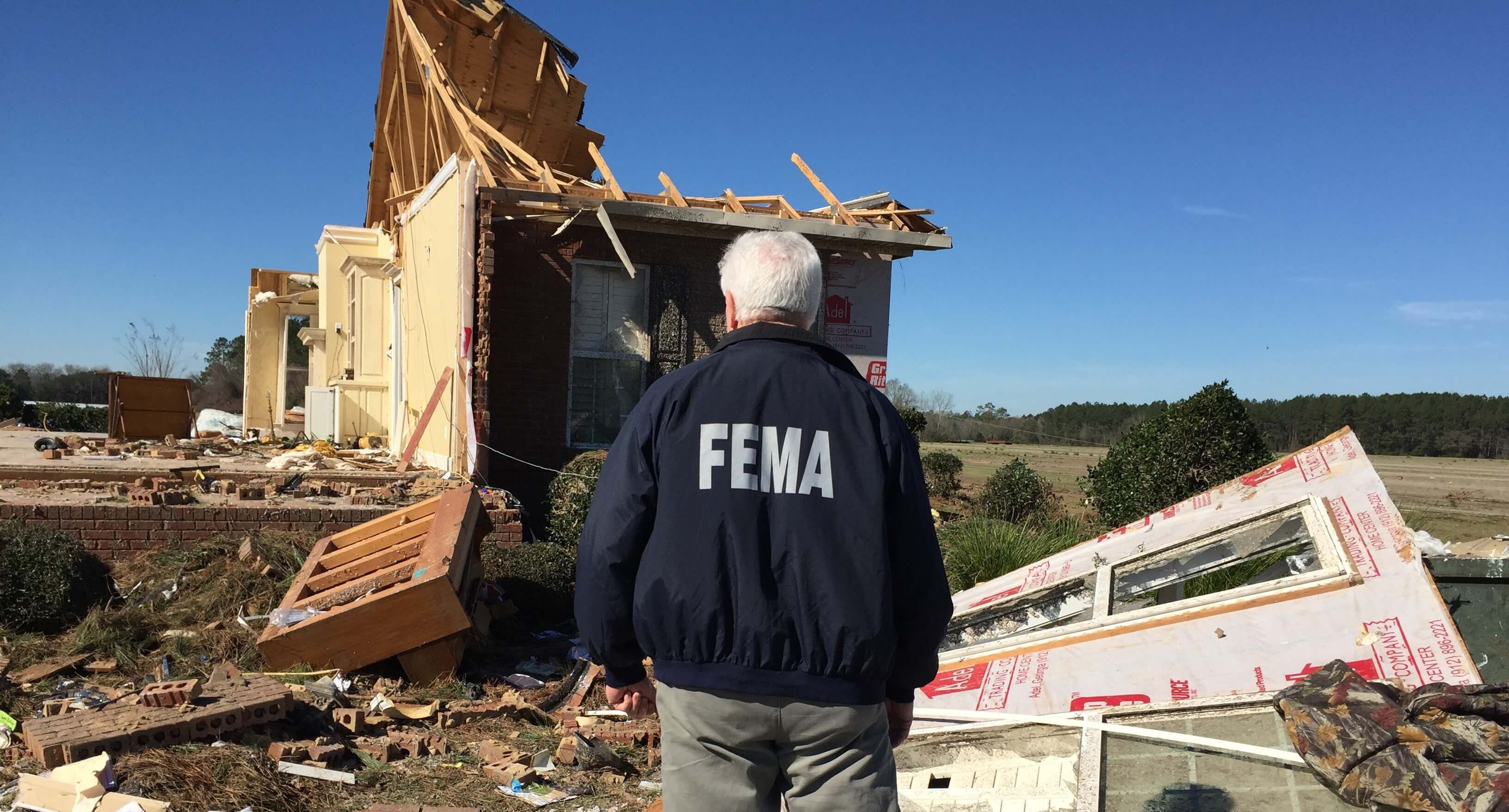FEMA worker overlooks wreckage from a disaster