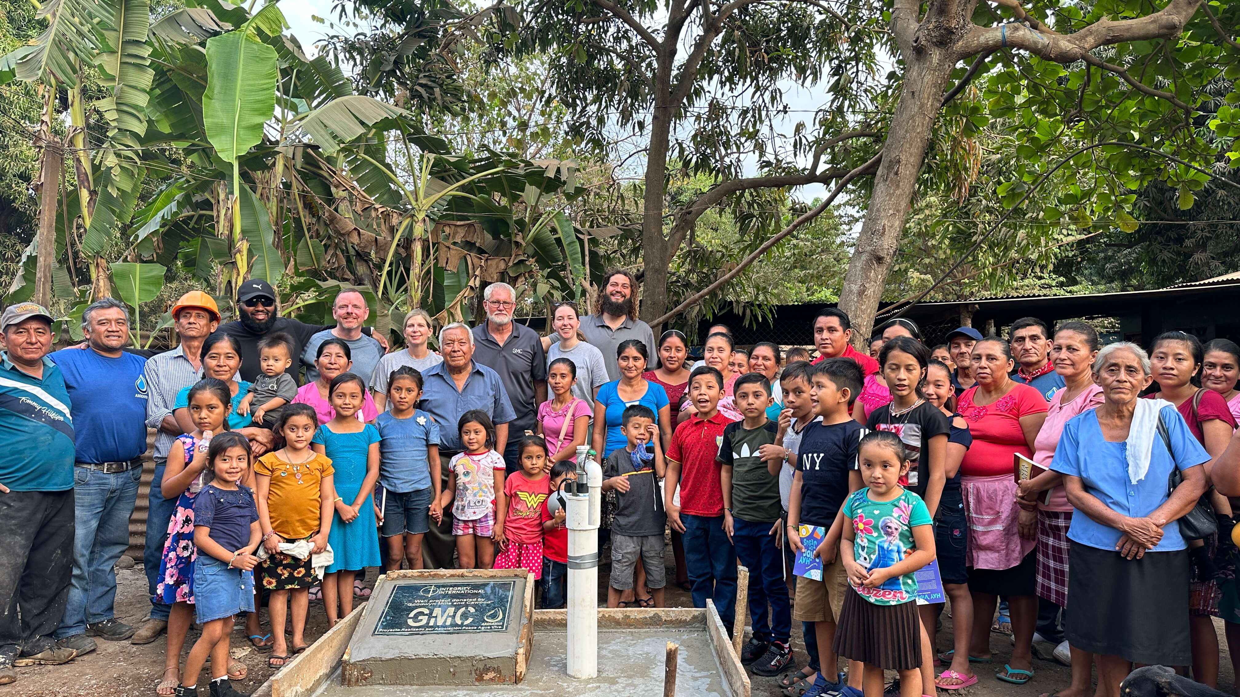 GMC team and Guatemalan community with new, designated well. 